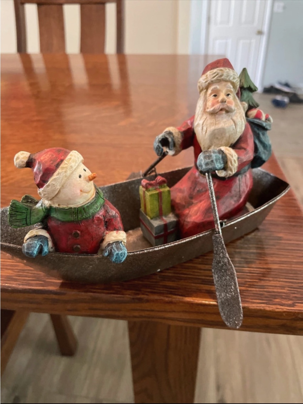 Santa and Snowman in metal fishing boat